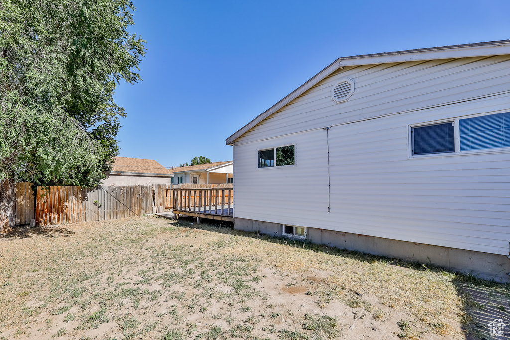 View of yard with a deck