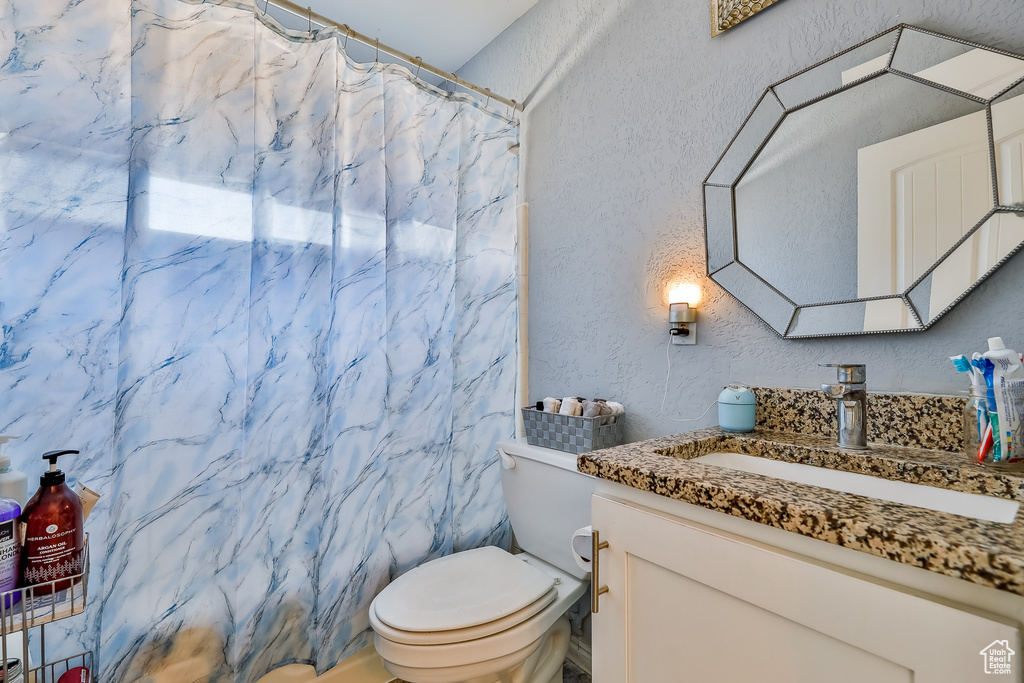 Bathroom with vanity and toilet