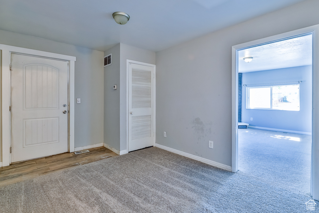 Unfurnished room with carpet floors