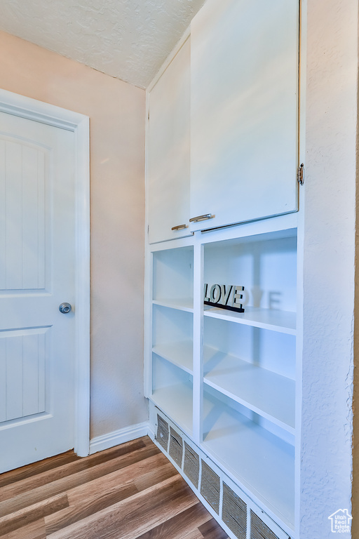 Mudroom with wood-type flooring