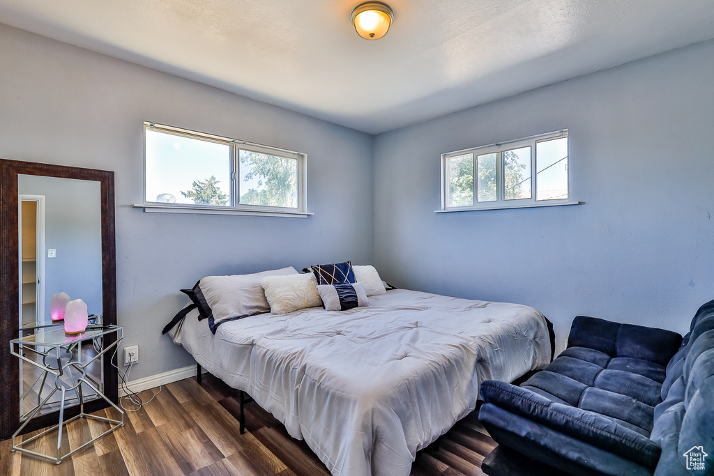 Bedroom featuring dark hardwood / wood-style floors