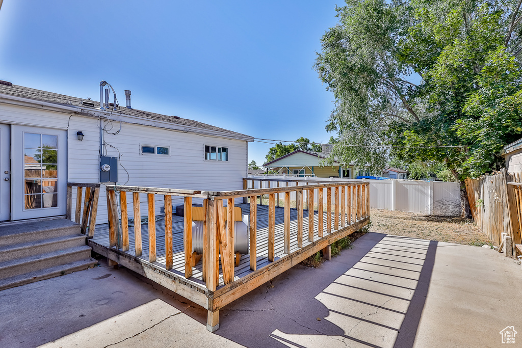 Wooden terrace with a patio area