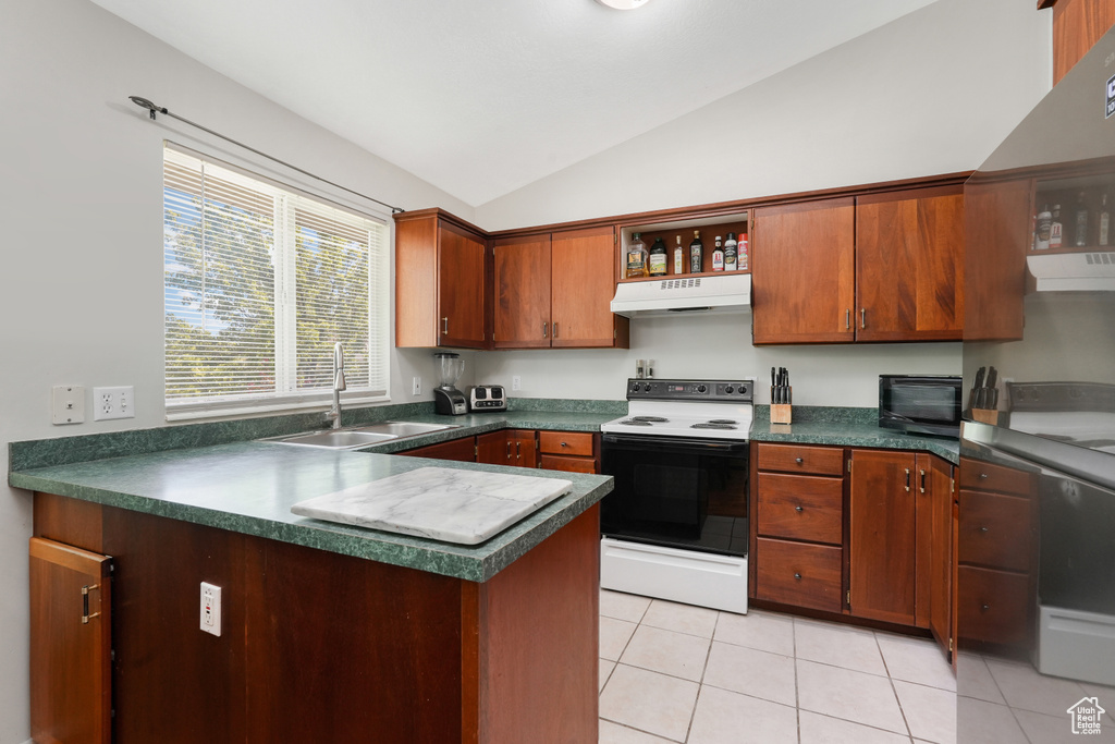 Kitchen with light tile floors, sink, white electric range, and lofted ceiling