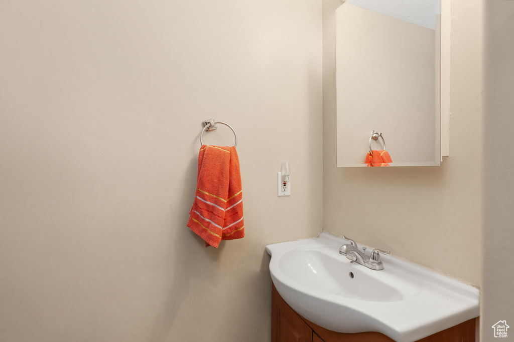 Bathroom featuring vanity with extensive cabinet space