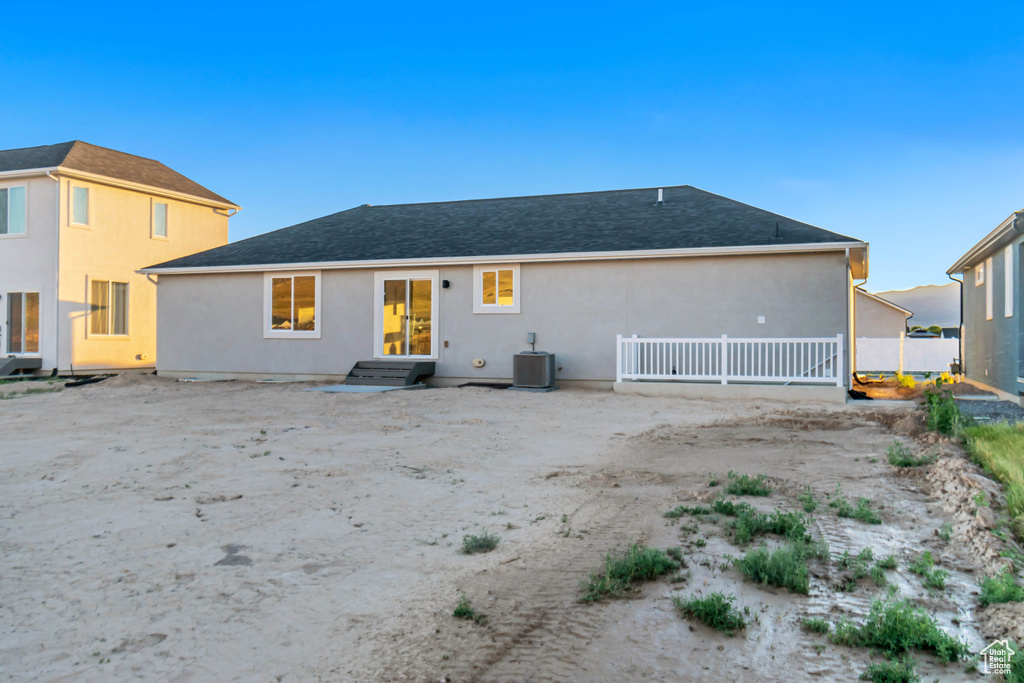 Back of property featuring a patio and central AC