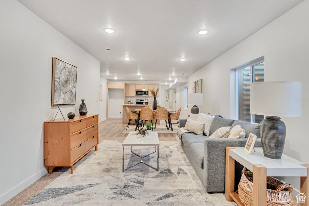 Living room featuring light carpet