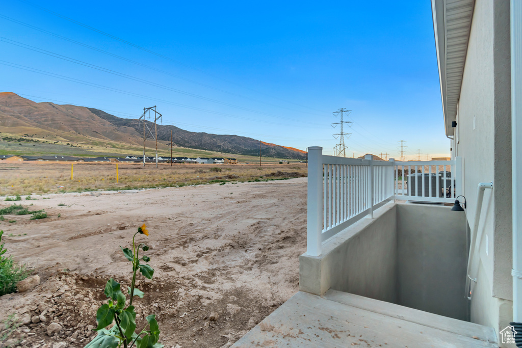 Property view of mountains with a rural view