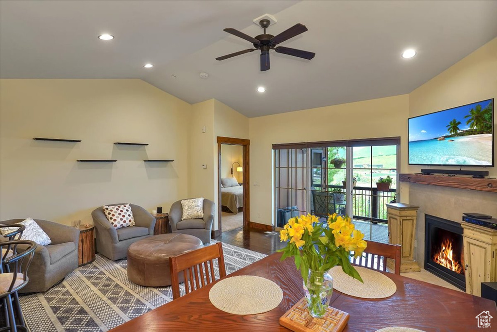 Dining space featuring light hardwood / wood-style floors, ceiling fan, and lofted ceiling