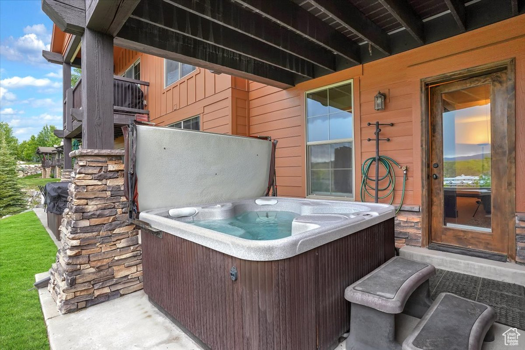 View of patio / terrace featuring a hot tub