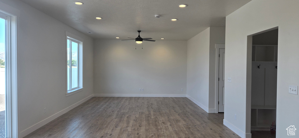 Spare room featuring ceiling fan and wood-type flooring