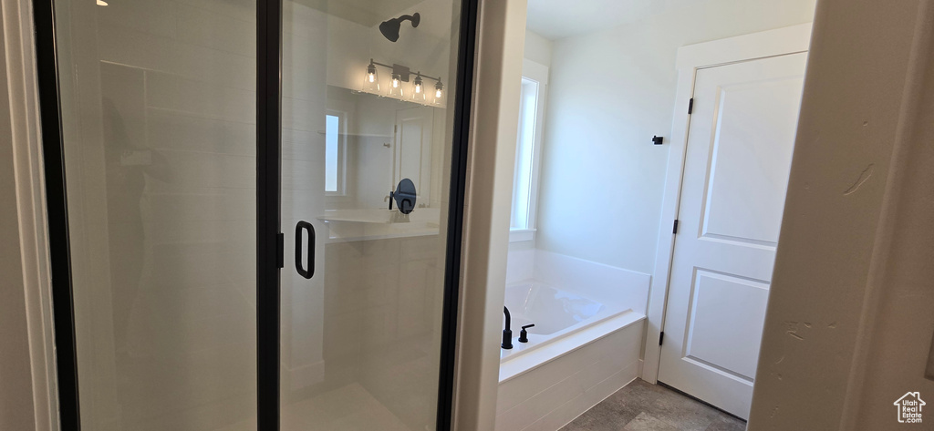 Bathroom featuring plus walk in shower