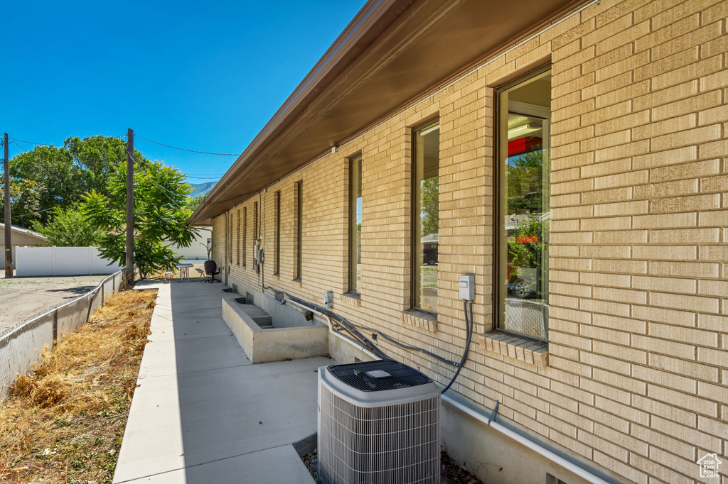 View of property exterior featuring central AC unit