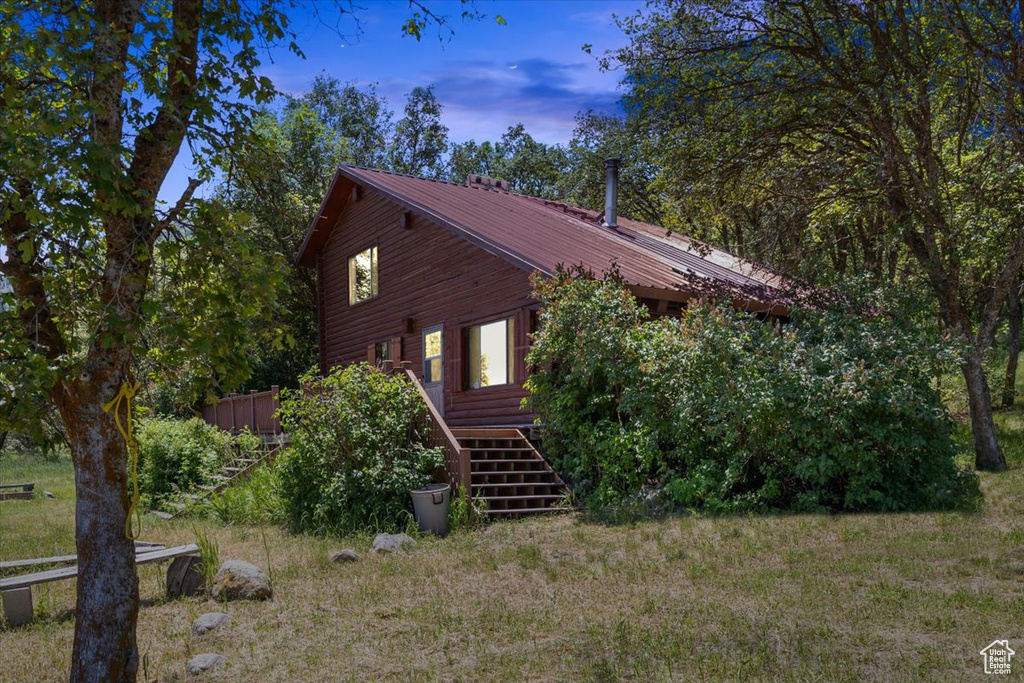 View of property exterior at dusk