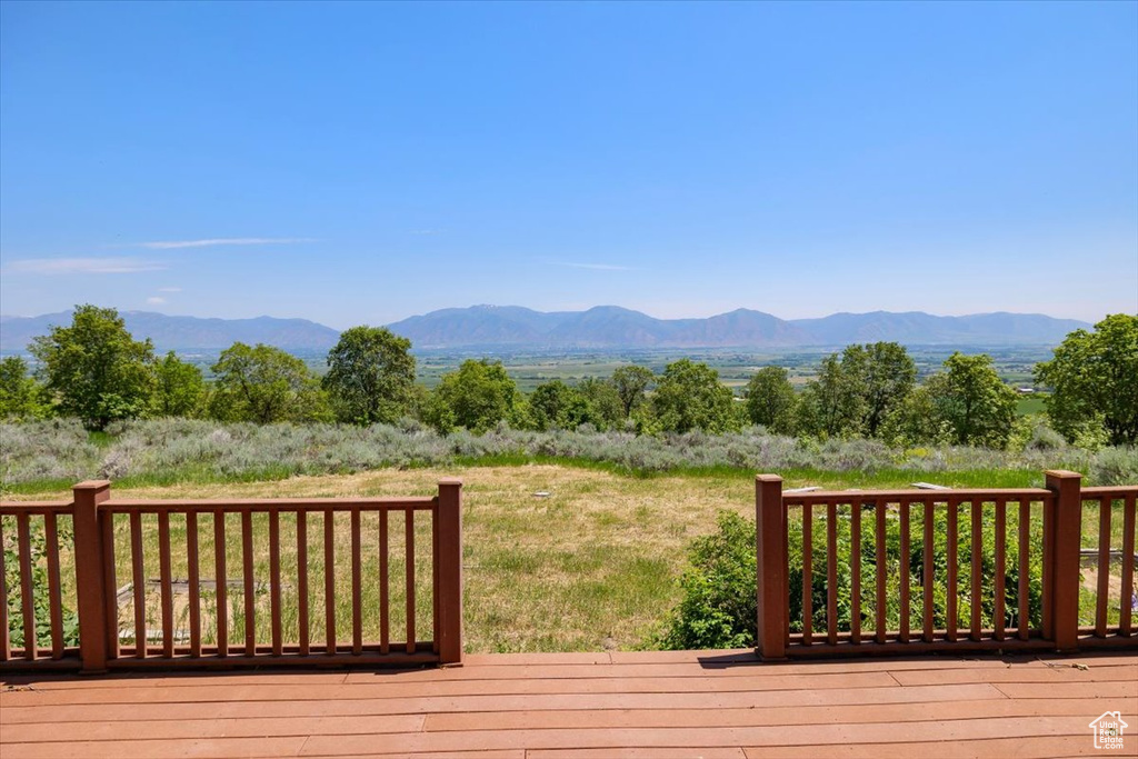 Wooden terrace featuring a mountain view