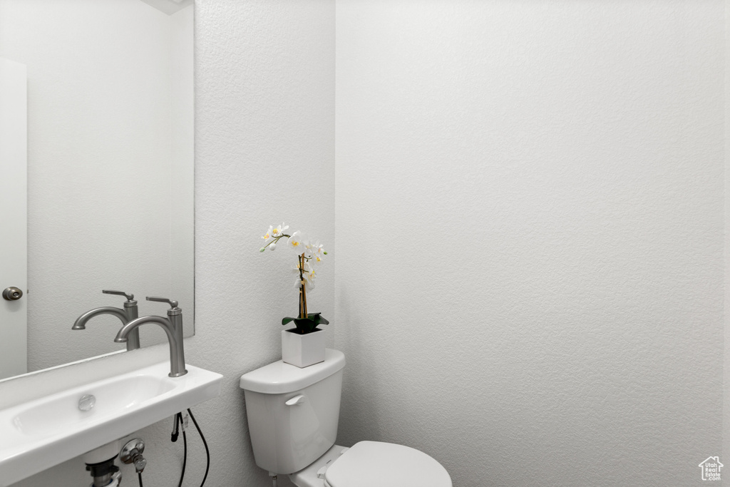 Bathroom with sink and toilet