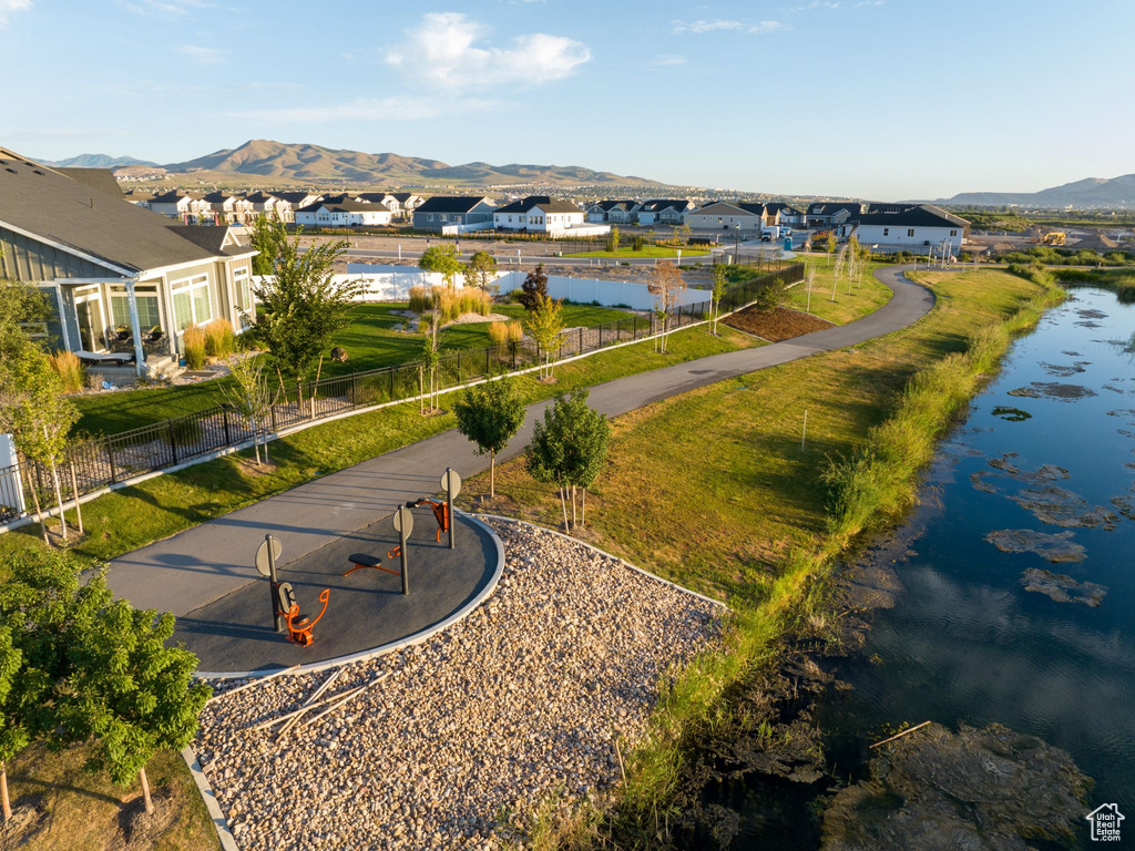 Drone / aerial view with a water and mountain view