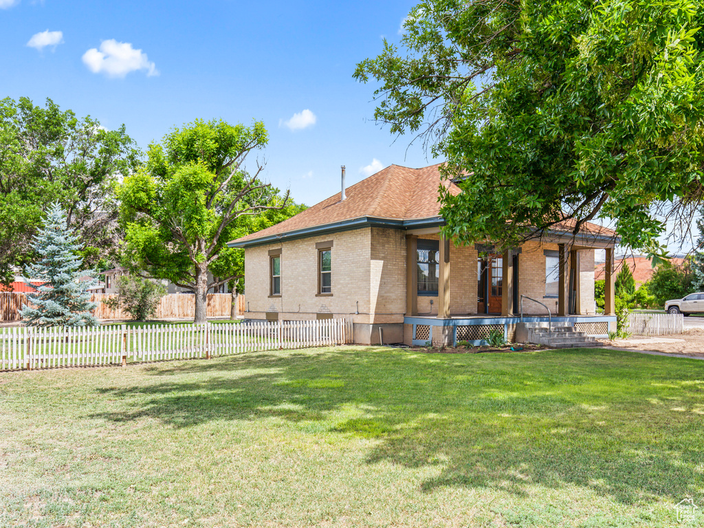 Exterior space with a front lawn