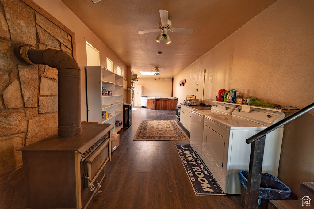 Hall featuring independent washer and dryer and dark wood-type flooring