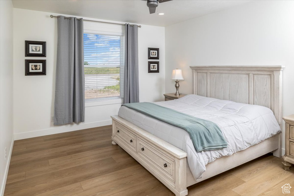 Bedroom featuring ceiling fan and light hardwood / wood-style floors