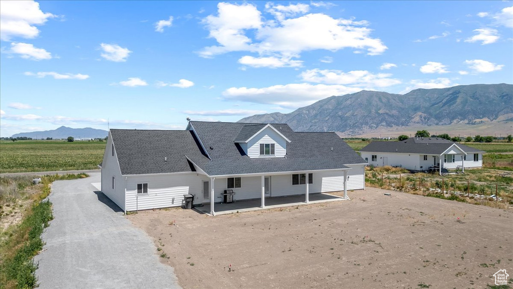 View of front of house with a mountain view