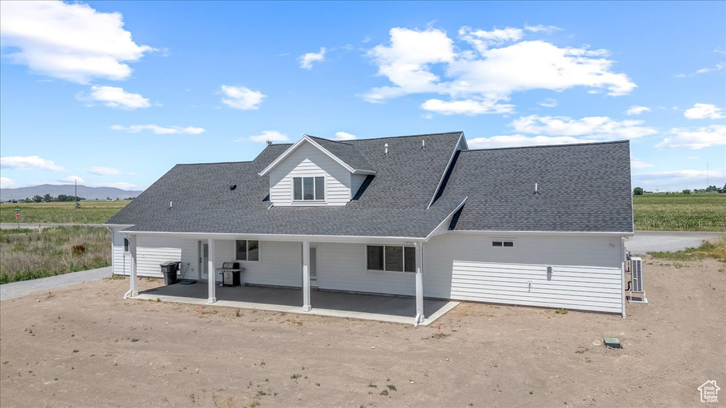 Back of property with a patio