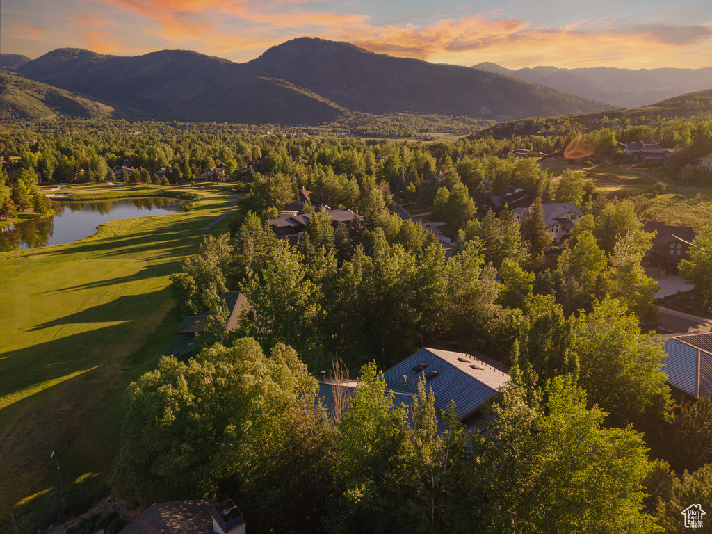 Aerial view at dusk with a water and mountain view