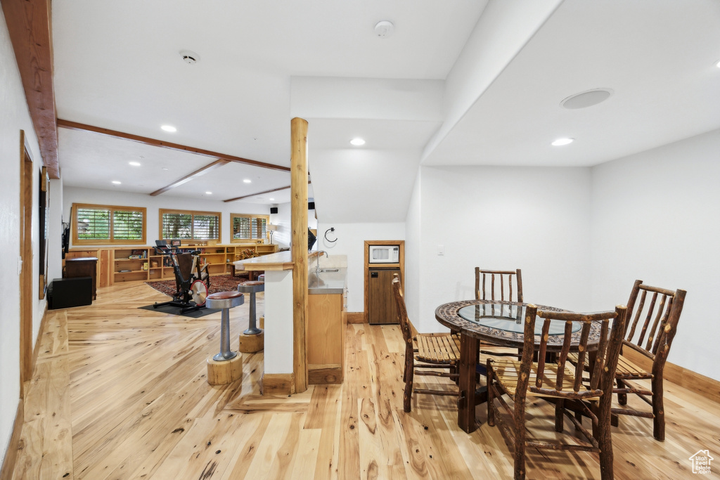 Dining room with light hardwood / wood-style flooring