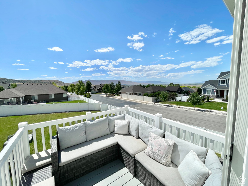 Deck featuring outdoor lounge area and a lawn