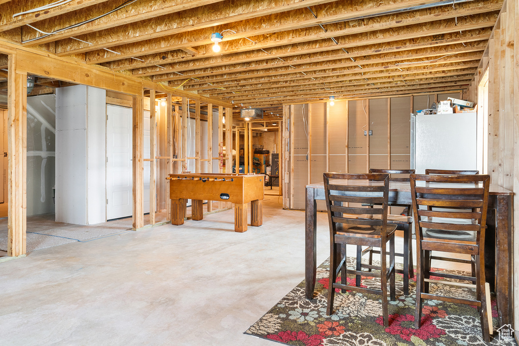 Basement with white fridge