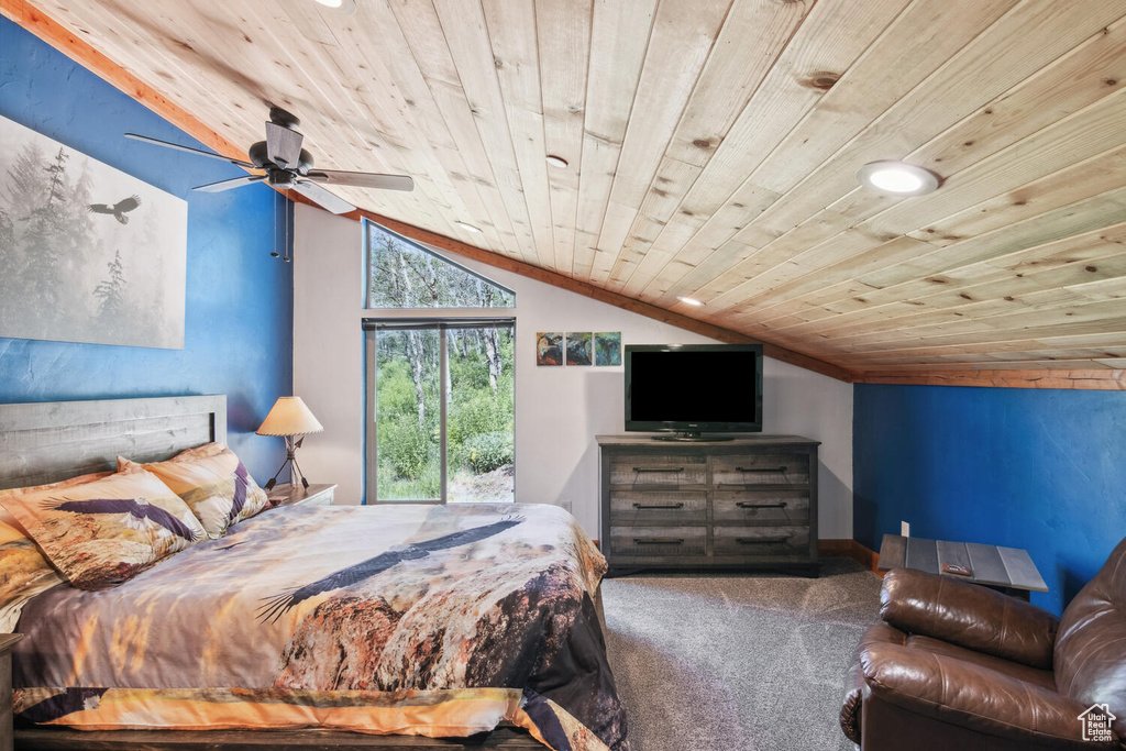 Carpeted bedroom featuring ceiling fan, vaulted ceiling, and wood ceiling