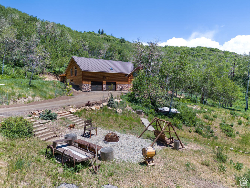 Exterior space with a fire pit