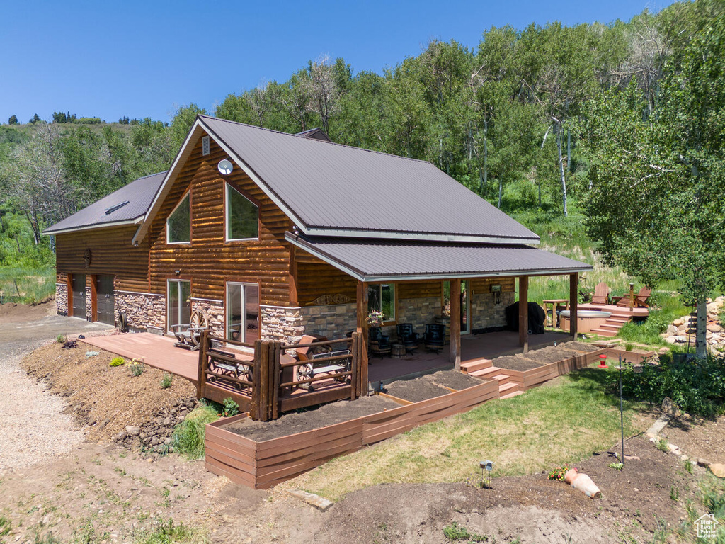 Log cabin with a patio