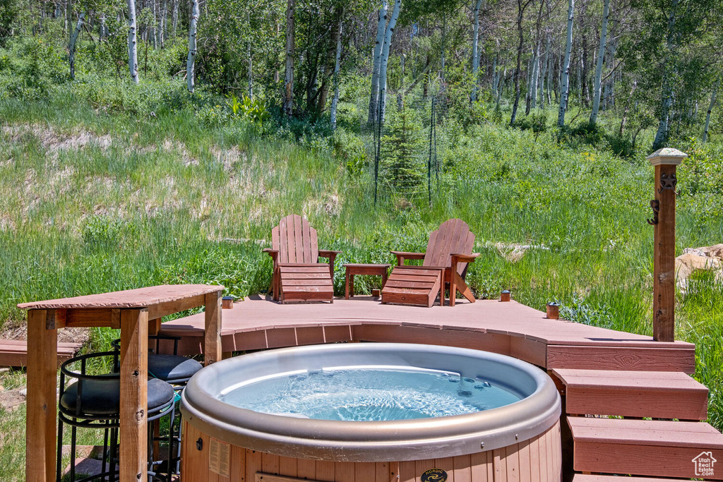 Deck featuring a hot tub