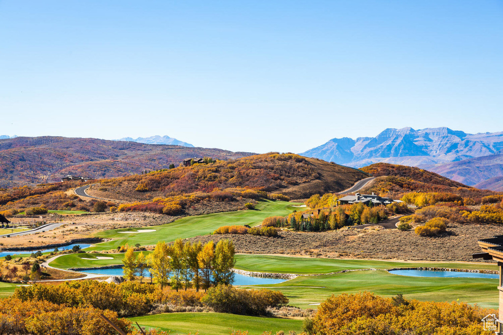 Property view of mountains featuring a water view