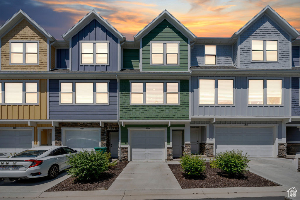 View of property with a garage