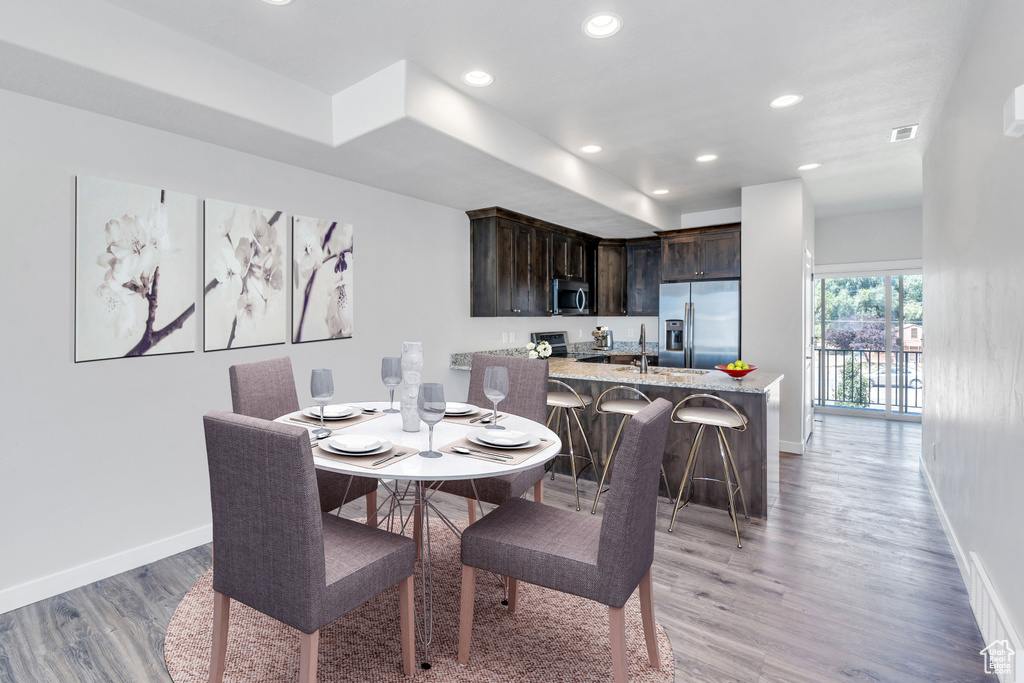 Dining space with light wood-type flooring