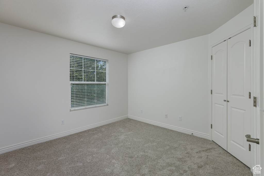 Unfurnished bedroom featuring carpet flooring