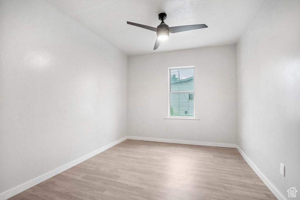 Unfurnished room featuring light hardwood / wood-style floors and ceiling fan