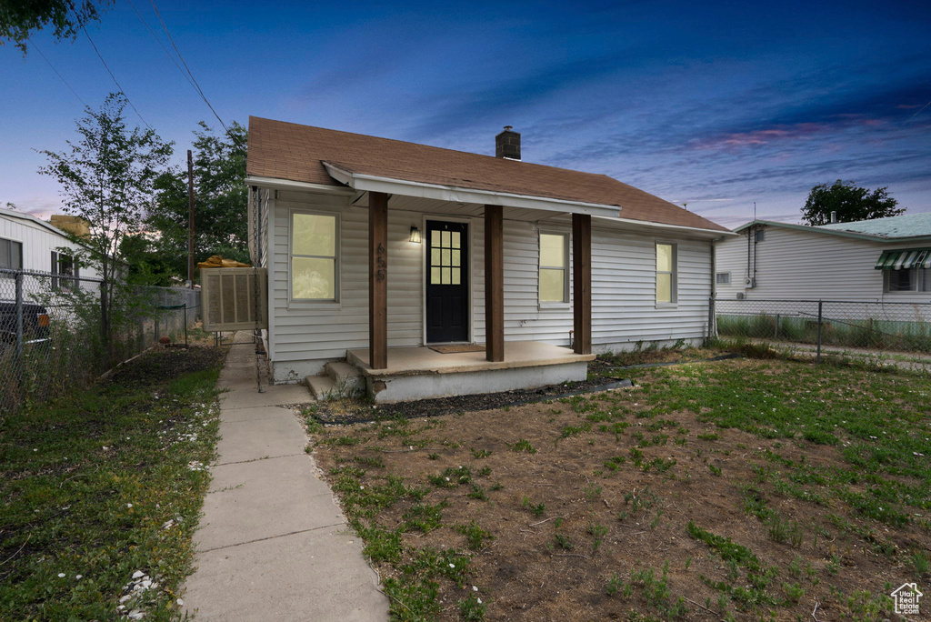 Bungalow-style home featuring a lawn