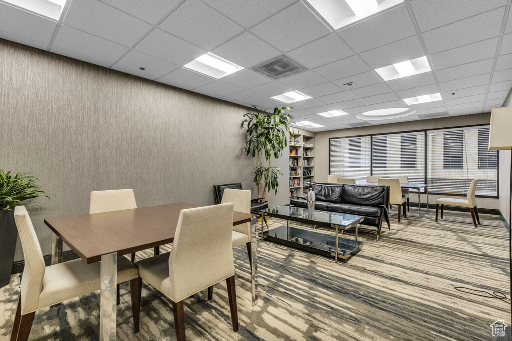 Dining area with a paneled ceiling