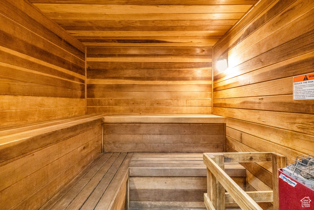 View of sauna / steam room with wood ceiling and wood walls