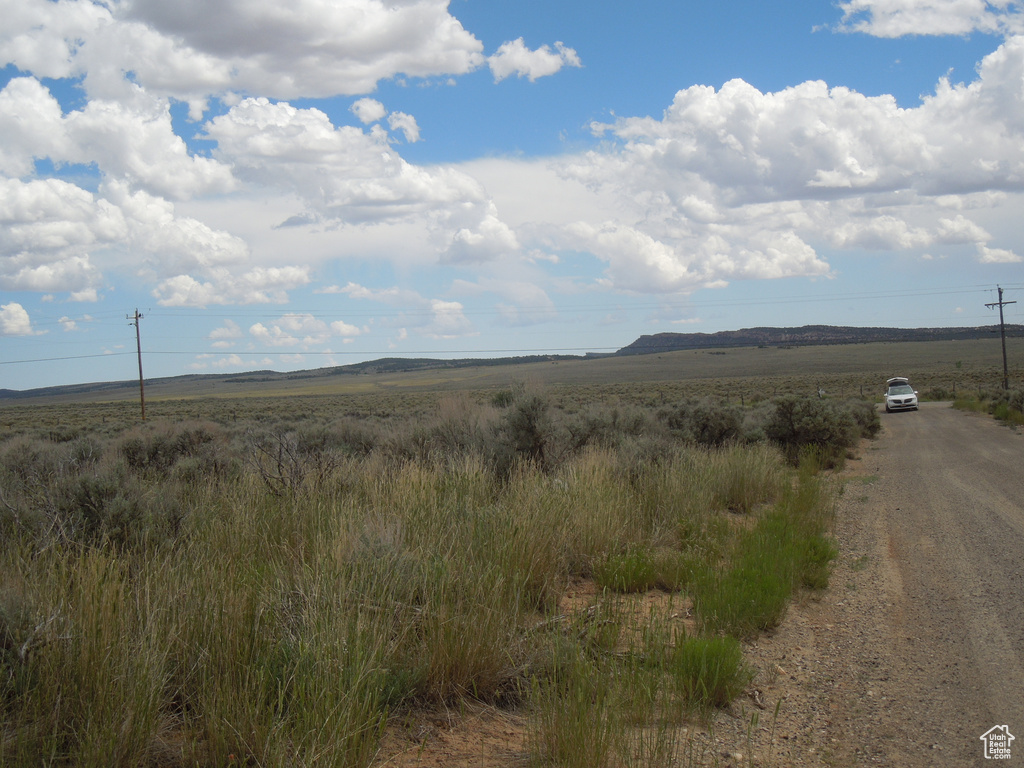 Property view of mountains with a rural view