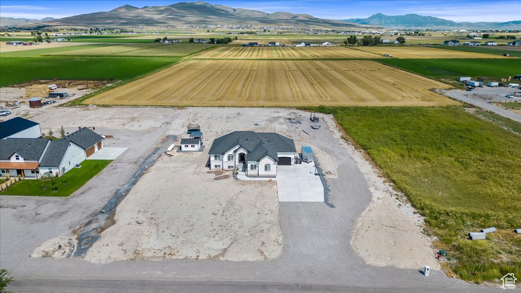 Birds eye view of property with a mountain view