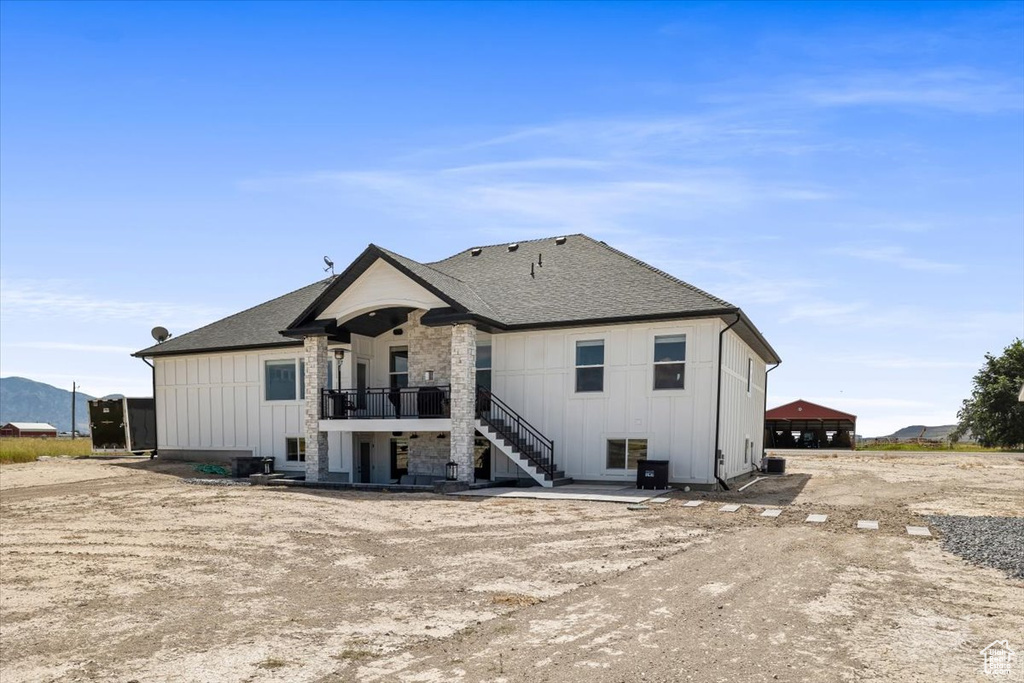 Rear view of property with central air condition unit