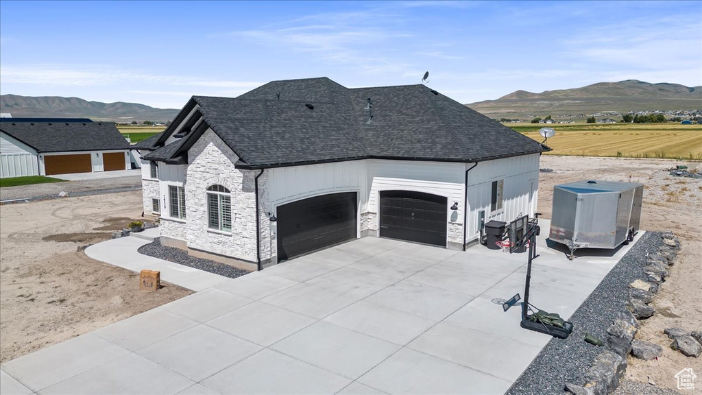 View of front of home featuring a mountain view