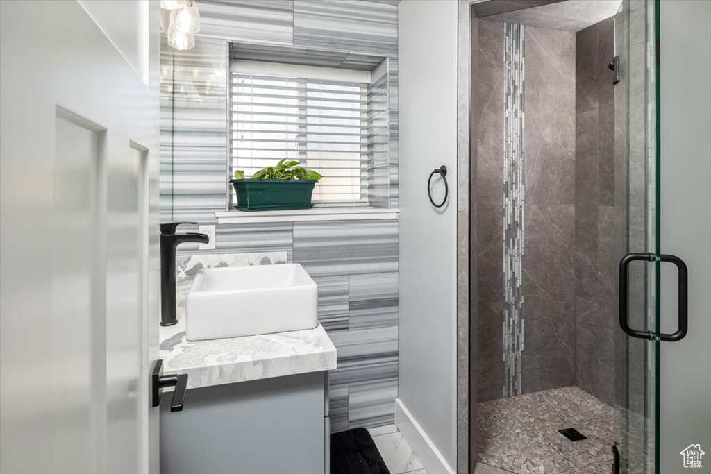 Bathroom with an enclosed shower and vanity