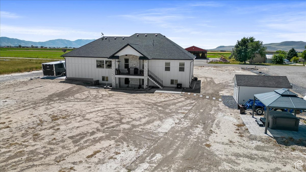 Rear view of house with a mountain view