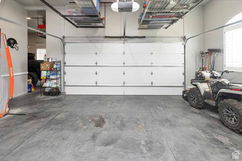 Garage featuring a garage door opener