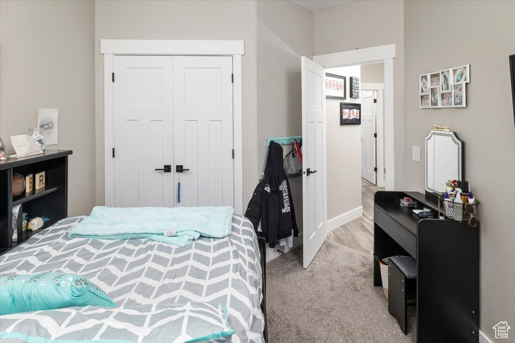 Bedroom with a closet and carpet floors