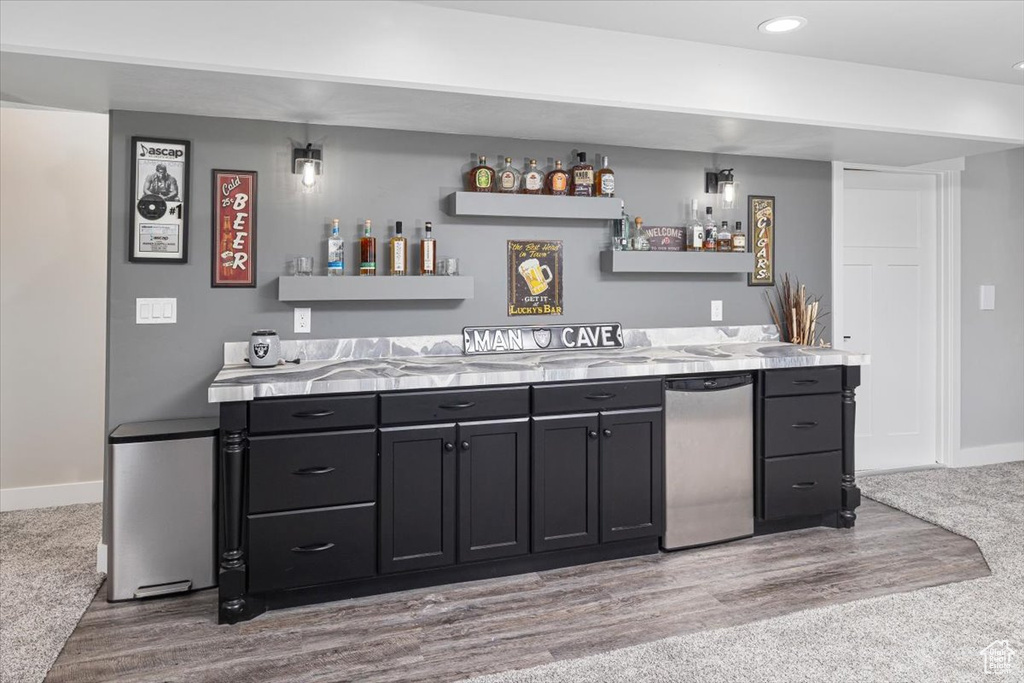 Bar featuring light colored carpet